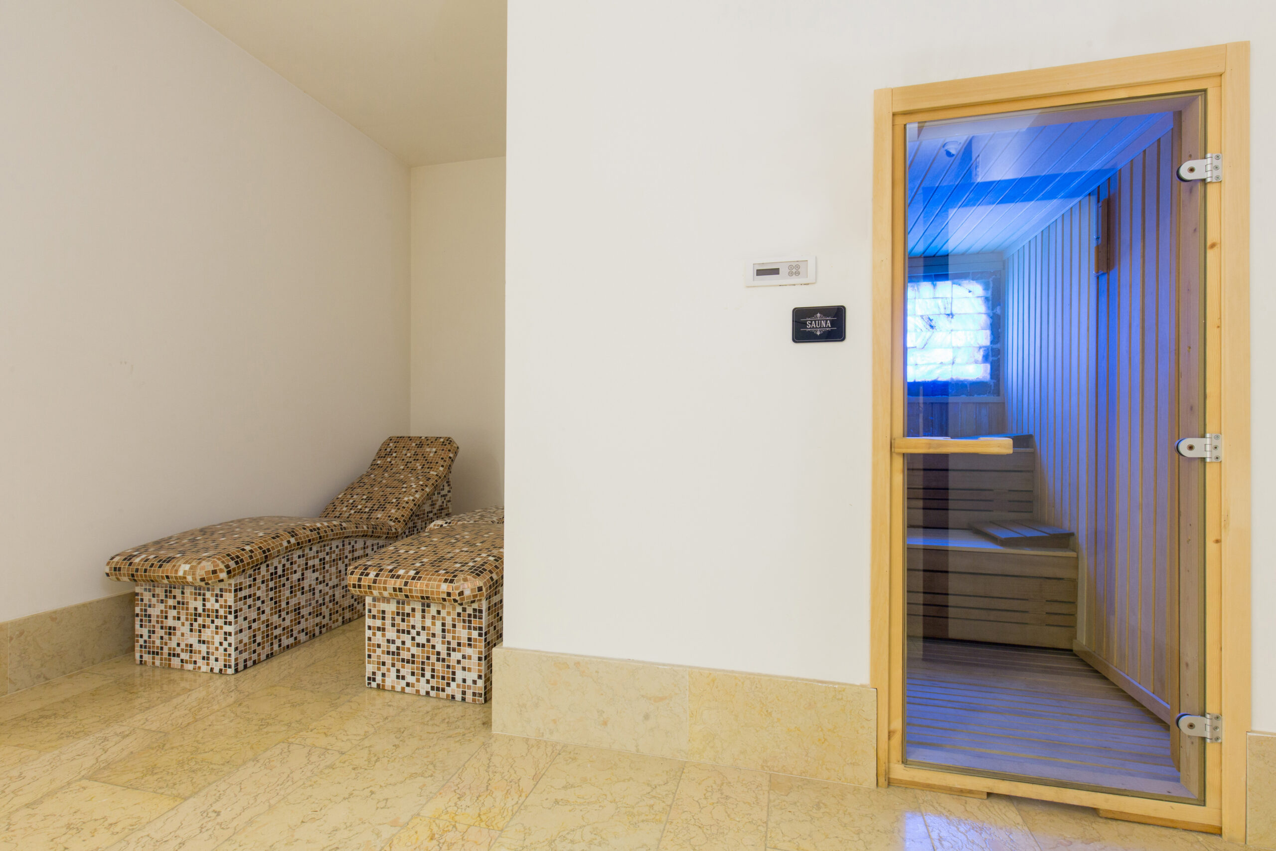 Heated tiled lounge seats in hotel spa center